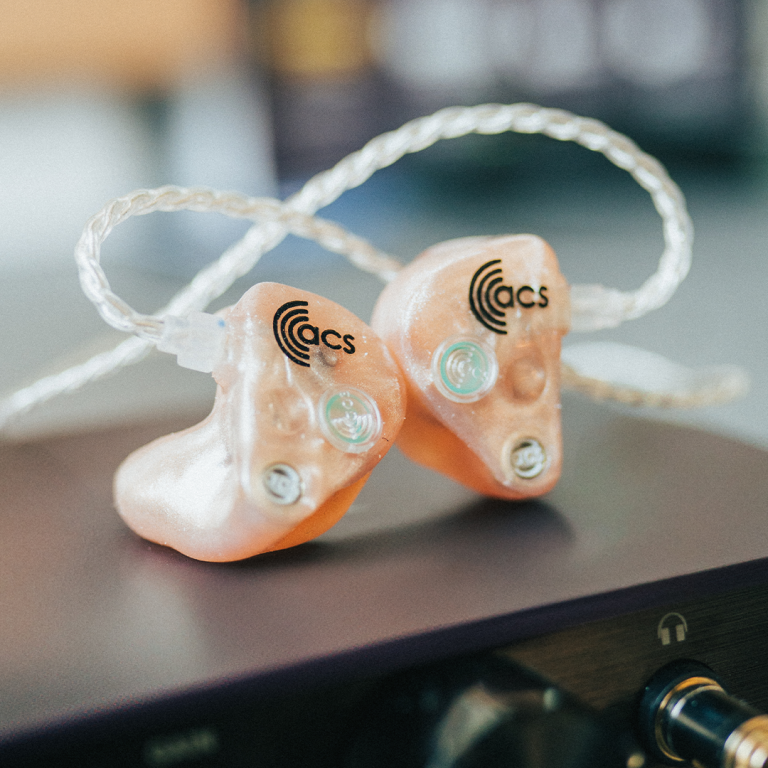 ACS In Ear Monitors in metalic champagne colour.