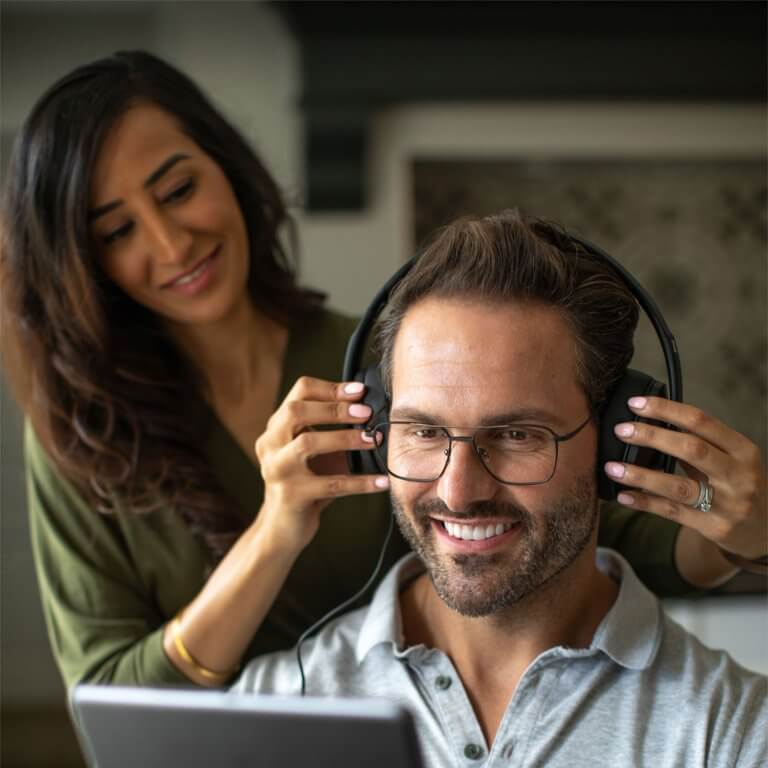 An audiologist performing a hearing assessment on a patient.