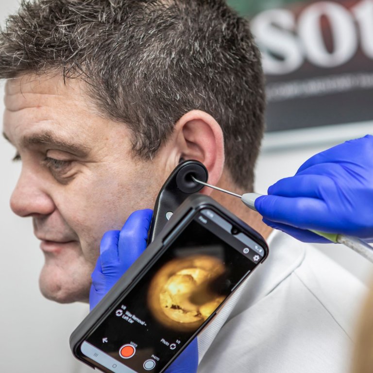 A patient having ear wax removal appointment.