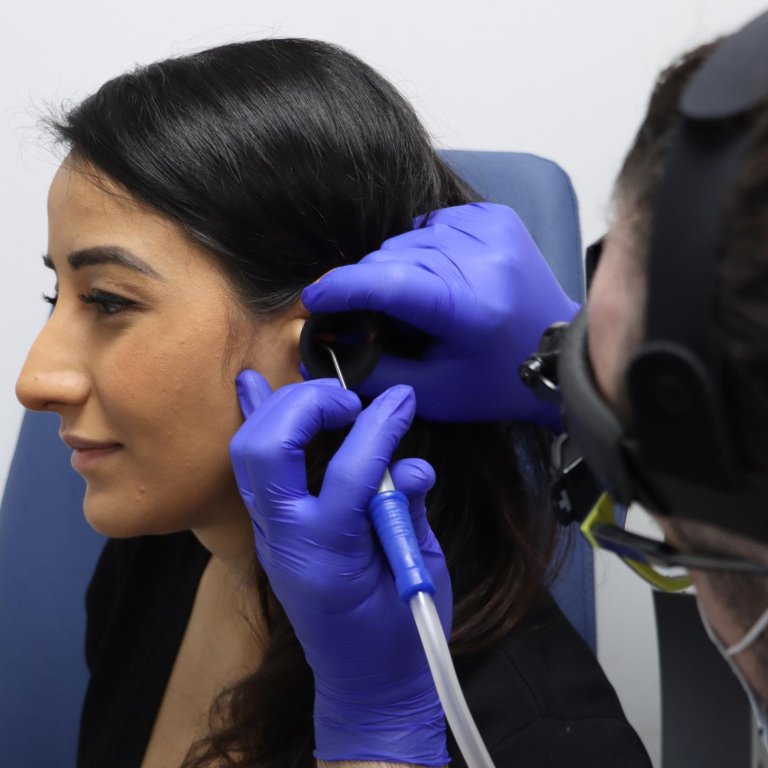 A patient having microsuction wax removal.