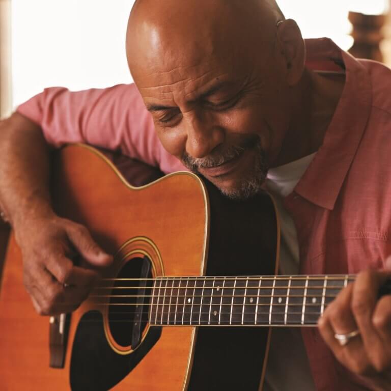 A man playing guitar.