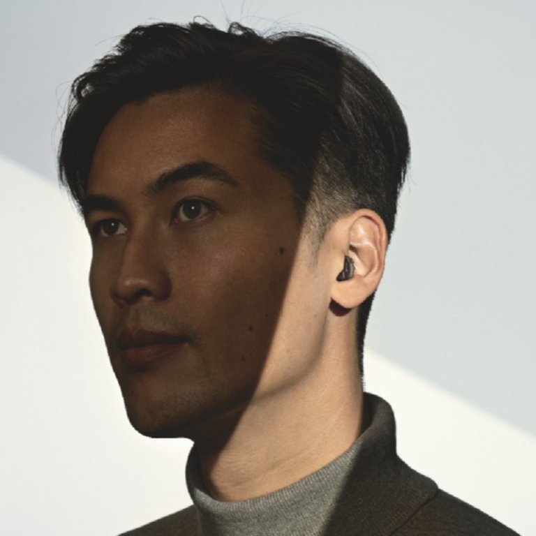 A man wearing a hearing aid.