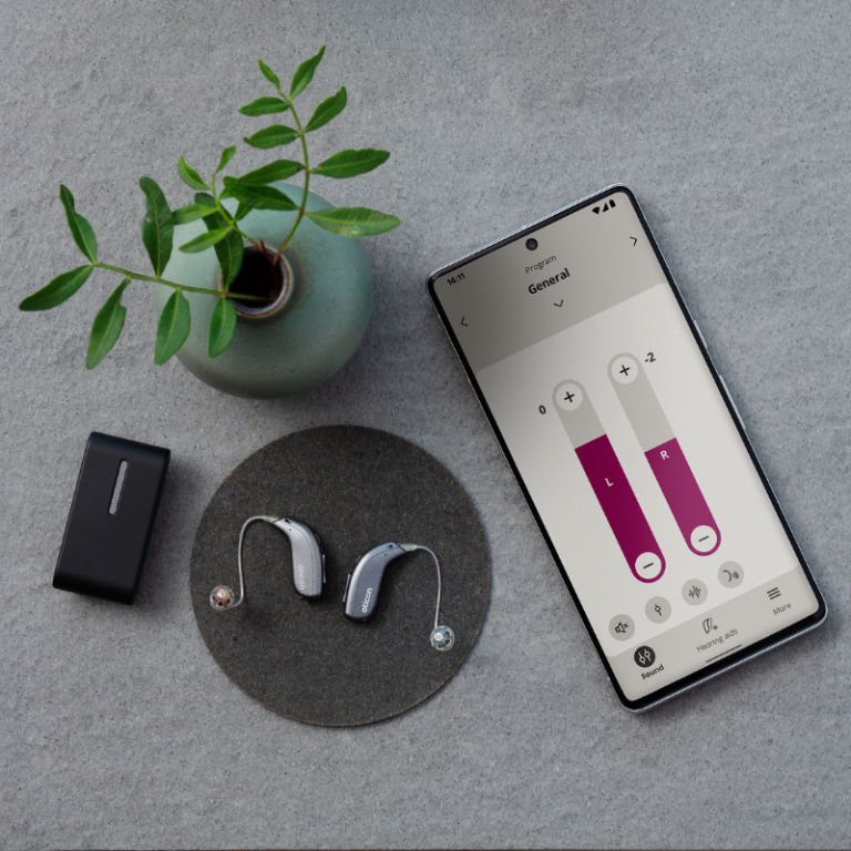 Oticon hearing aids connected to the app on the phone to manage the volume.