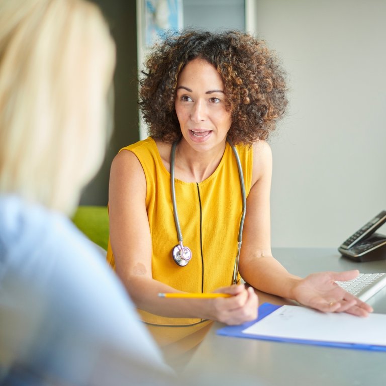 A doctor talking with her patient.