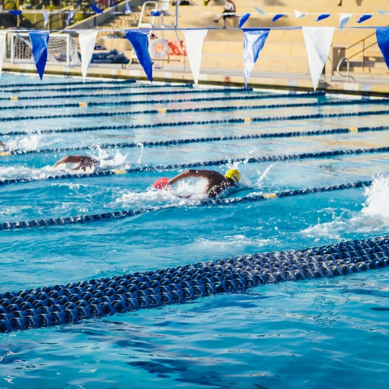 Swimmers in a swimming pool.