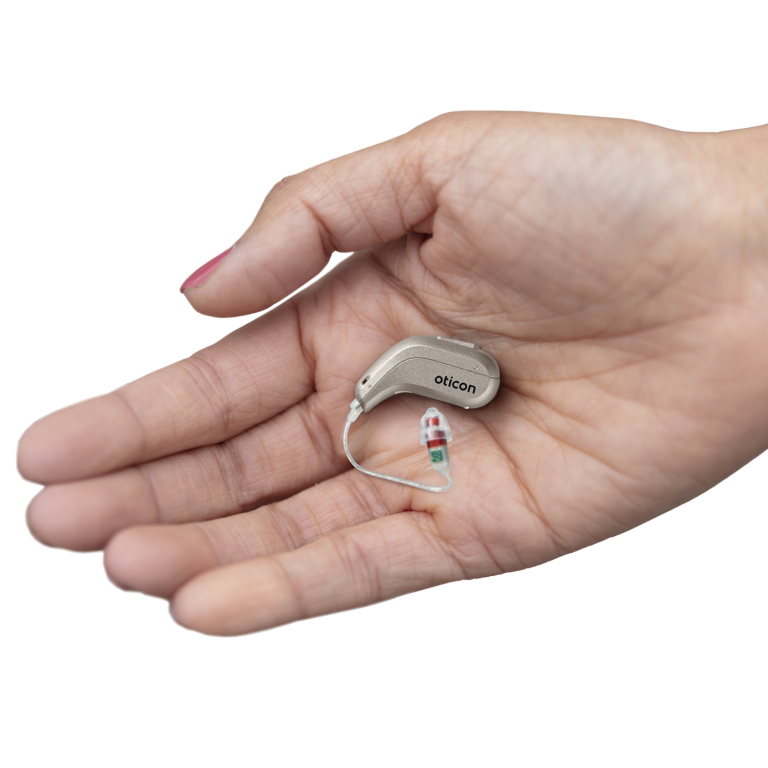 Oticon Intent hearing aids in a hand.