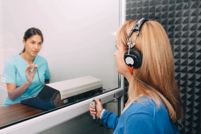 A patient having a speech audiometry test during her hearing assessment.