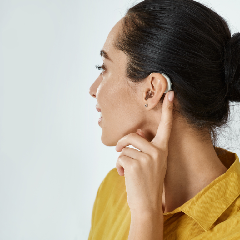 A woman wearing a hearing aid.