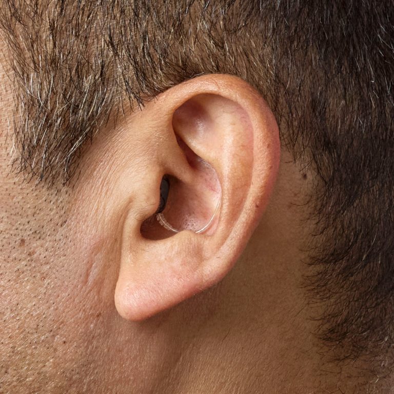 A man wearing Oticon Zeal in ear.