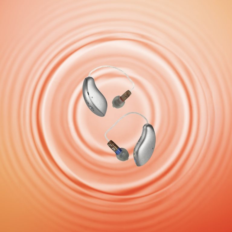Starkey Omega AI hearing aids on a orange background.