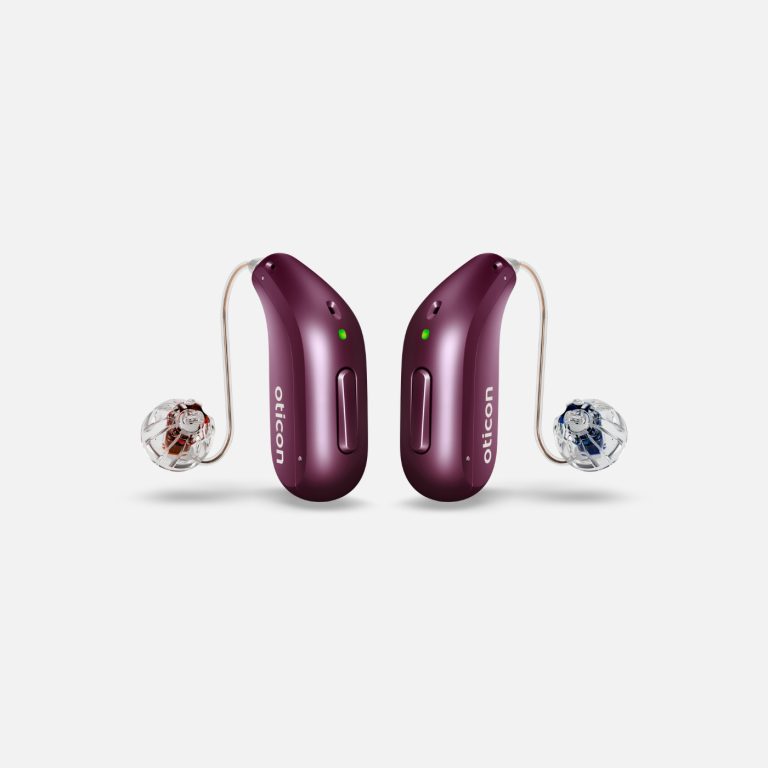 Oticon Reveal, behind-the-ear hearing aids, deep plum colour.